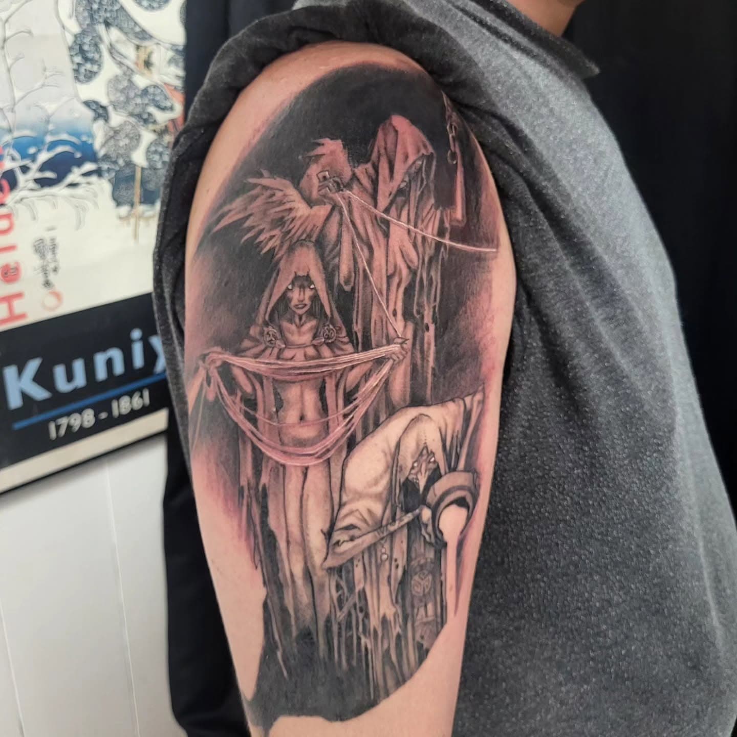 Black and white tattoo of vikings pulling strings